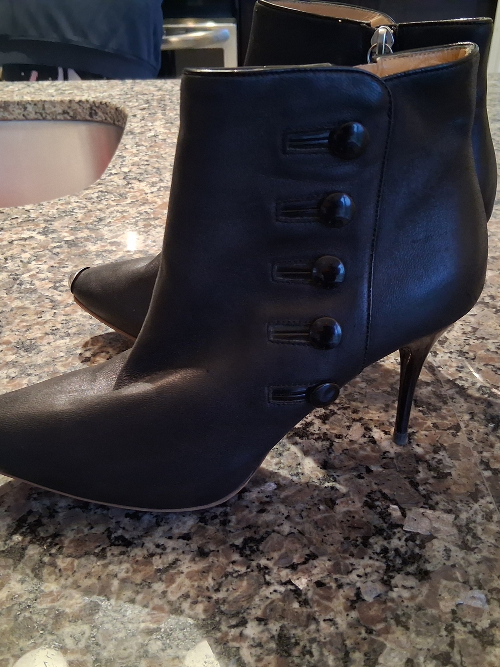 Step into Subversive Chic: Alexander McQueen Black Leather Ankle Boots